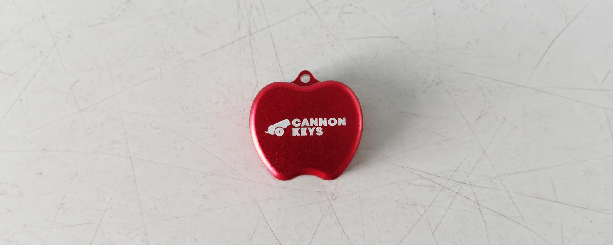 CANNON KEYS logo laser engraved on a red metal switch opener