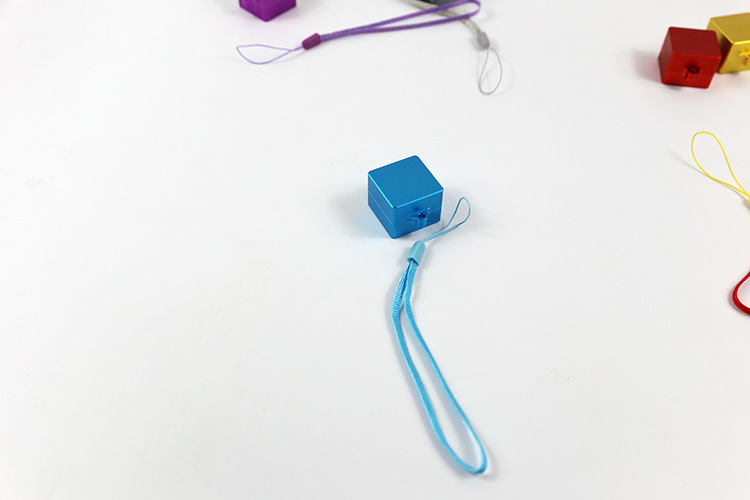 Blue metal switch opener fitted with a matching wrist strap