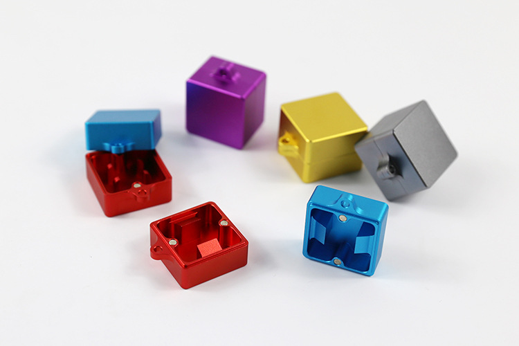 Group of compact metal switch openers in red, blue, purple, gold and gray