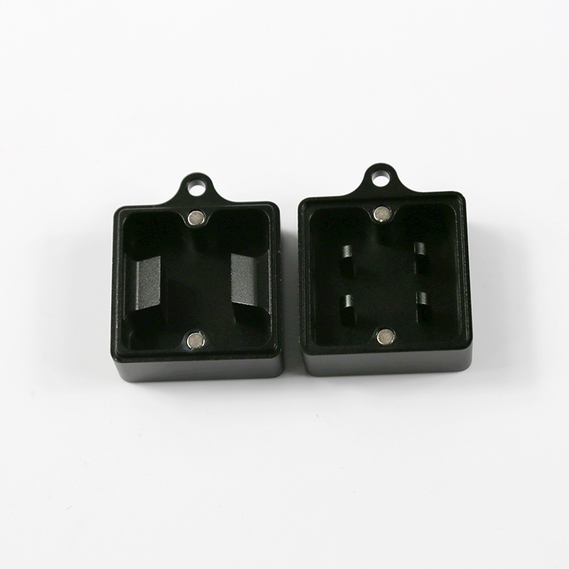 Black metal keyboard switch opener shown open