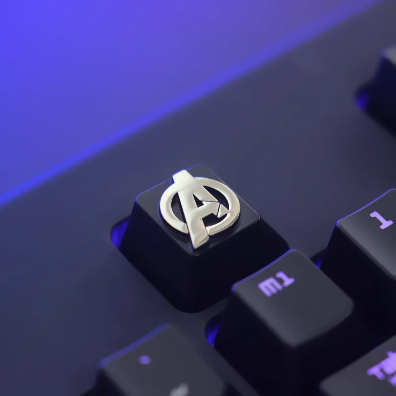 Silver Avengers metal keycap with raised emblem
