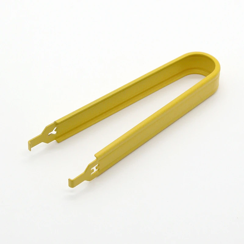 Gold U-shaped switch puller